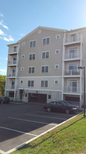 multi-family building with parking garage on first level