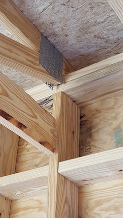 Wood studs coming to a corner joint