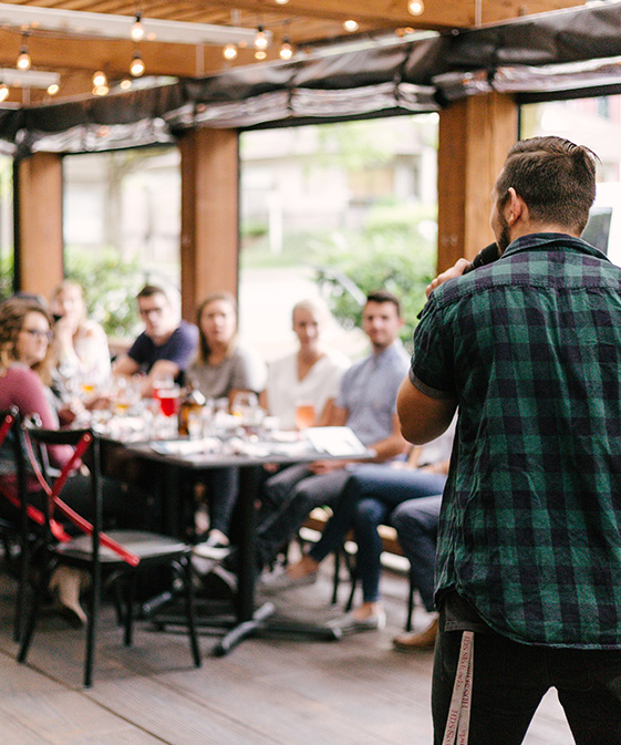 Person Presenting to an Audience at an Event