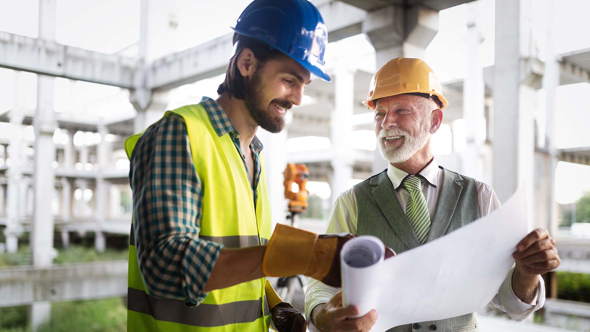 Construction engineer with foreman worker checking construction site