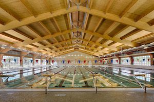 Wood framed roof over aquatic center pools