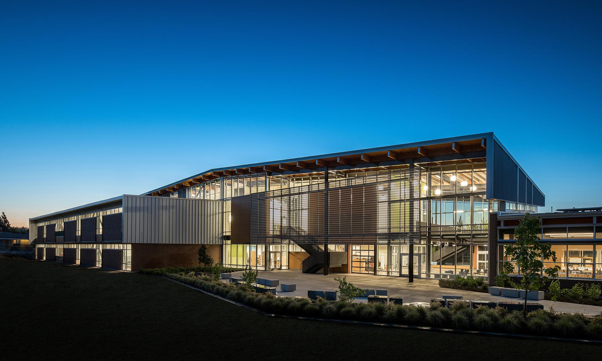 Arts and Technology Academy exterior with lit up interior