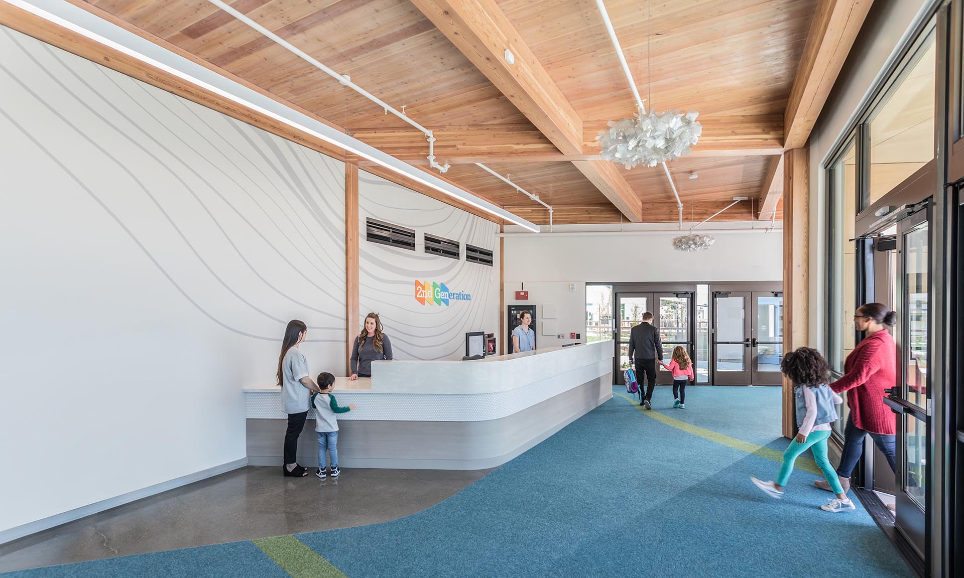 Genentech Child Care Center entryway with kids and parents