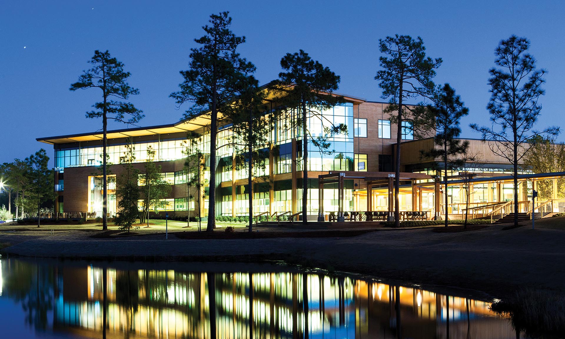 The Grove at Live Oak Bank exterior lit up