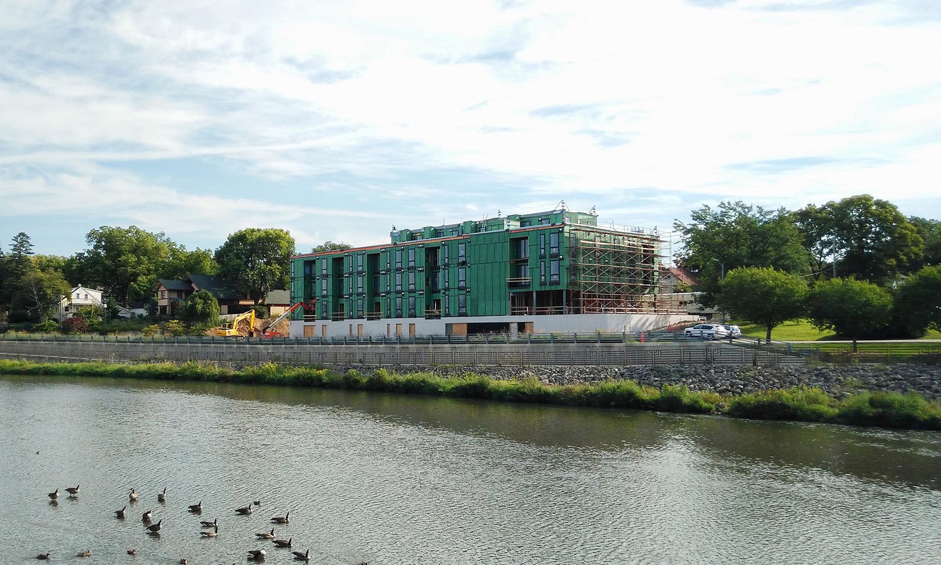 Lofts at Mayo Park exterior from water under construction