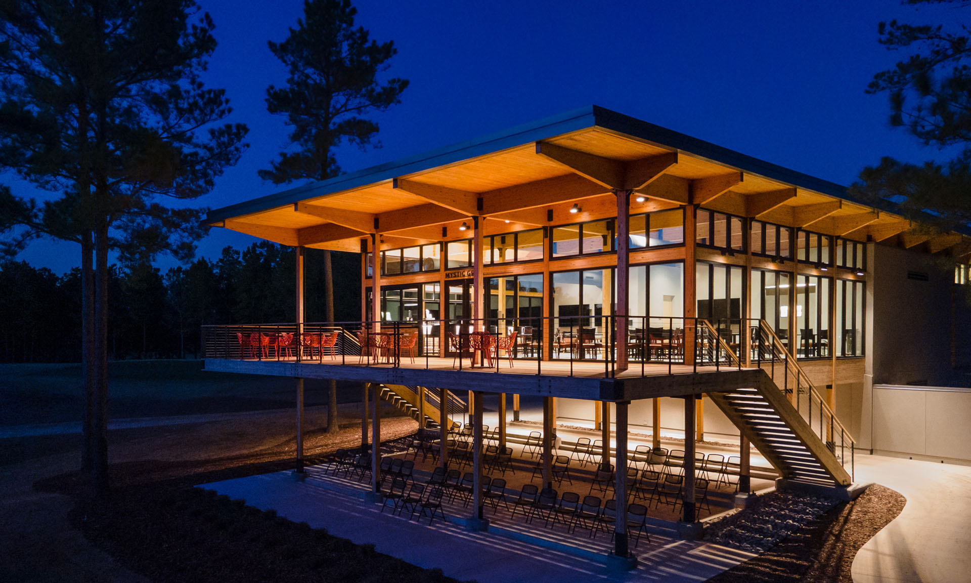 Mystic Creek Clubhouse lit up at night