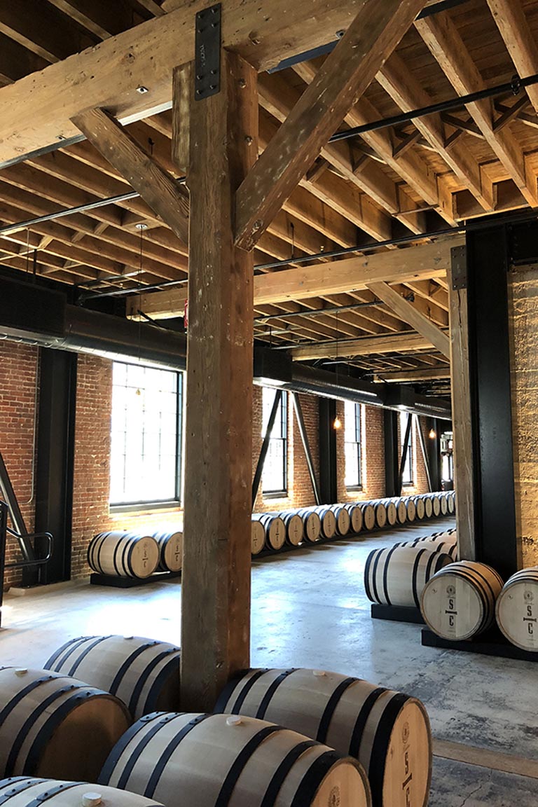 Savage and Cooke Distillery wood framing and barrels